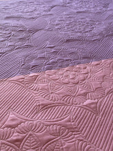 Load image into Gallery viewer, Close up of the Cora's Star block design stitched out on two-tone purple fabric.